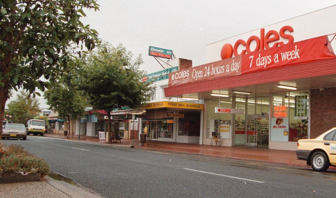 Flashback: A 1999 picture showing the vacant Ewart Brothers store with a yellow awning between the Soul Pattison Wodonga Pharmacy and Coles Supermarket.