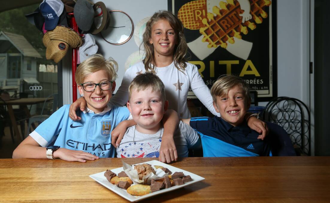 GOOD Samaritans: Harry Chapman, 6, (centre) with the Ault-Connell siblings Eva, 11, Elka, 9, and Jensen, 7, who raised more $3600 with fire victims through their cake stall in Albury. Picture: TARA TREWHELLA