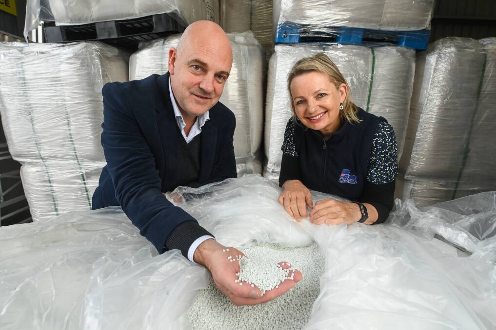 Small things, big venture: Former Albury HIgh and Scots School student Chris Sayers with Sussan Ley and plastic beads earmarked for recycling. Picture: MARK JESSER