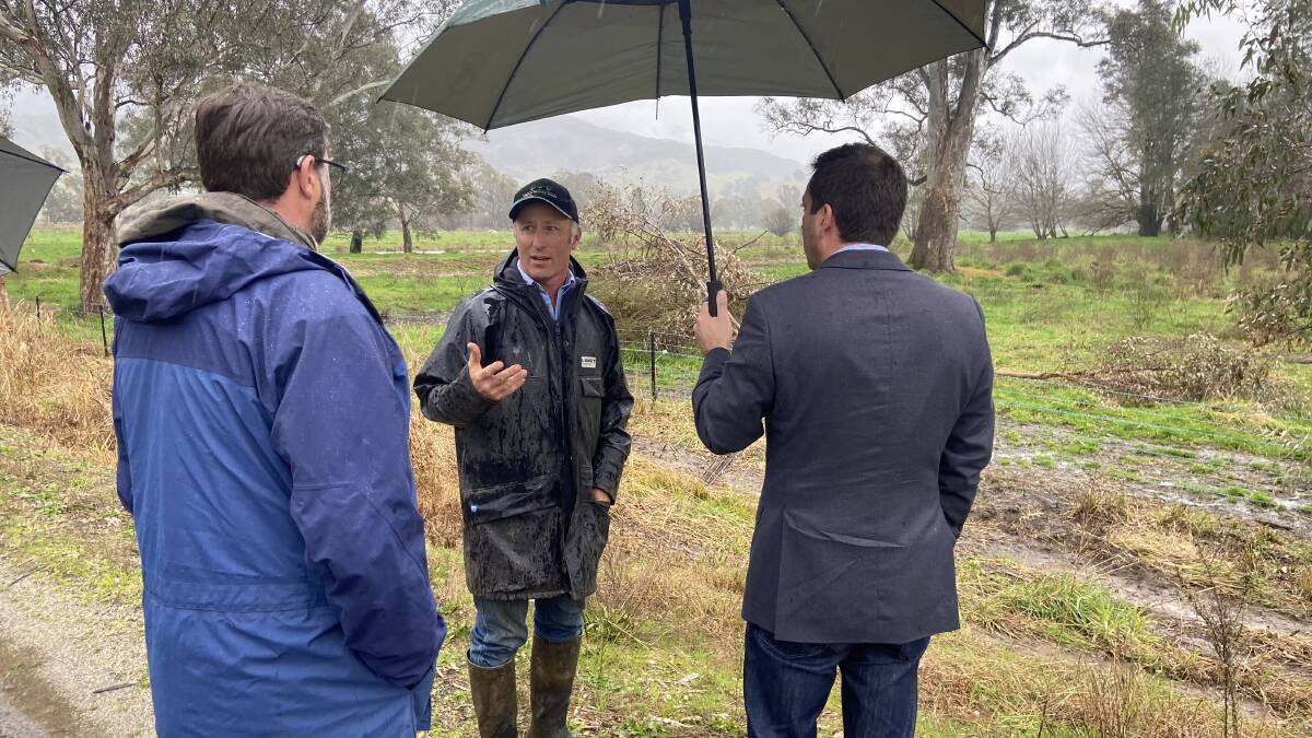 Firsthand briefing: Kergunyah South farmer Stuart Crosthwaite speaks to Bill Tilley and Matthew Guy about the impact of camping being allowed along river frontages. His property borders the Kiewa River.