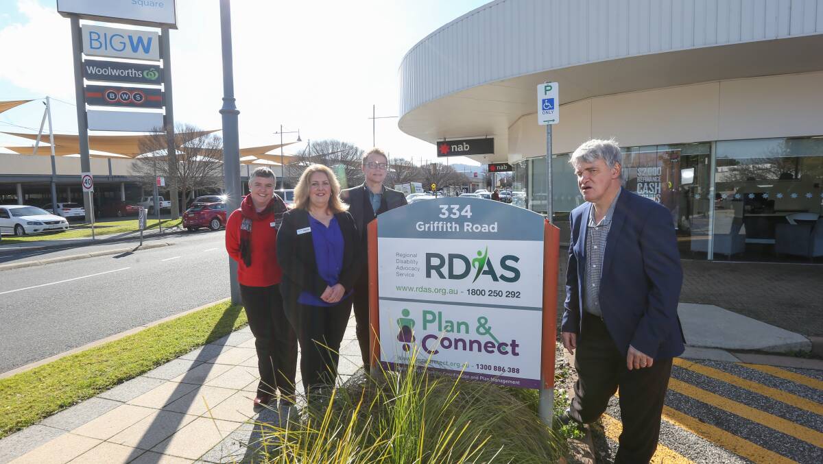 Positive sign: Regional Disability Advocacy Service and Plan & Connect staff Meliissa Race, Dianne Spalding, Reg Dury and Martin Butcher at the opening of their new office on Thursday. Picture: TARA TREWHELLA