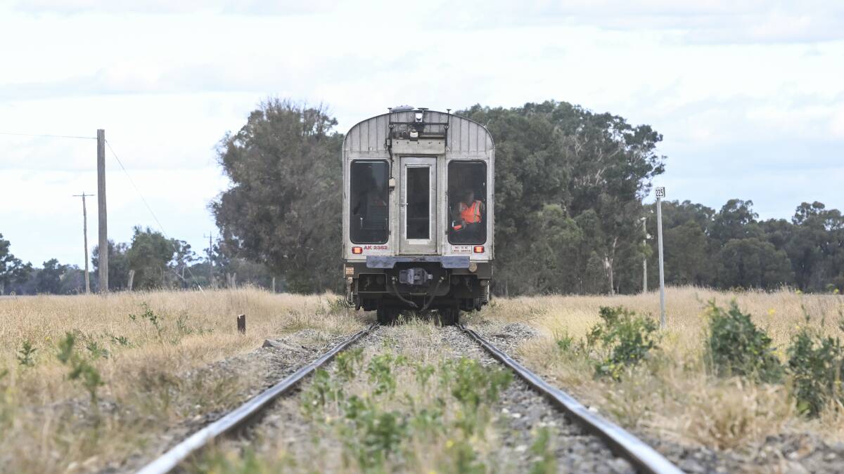 A monitor looks out the rear of the AK track test train as it travels along the Benalla to Yarrawonga railway earlier this month. Picture by Mark Jesser 