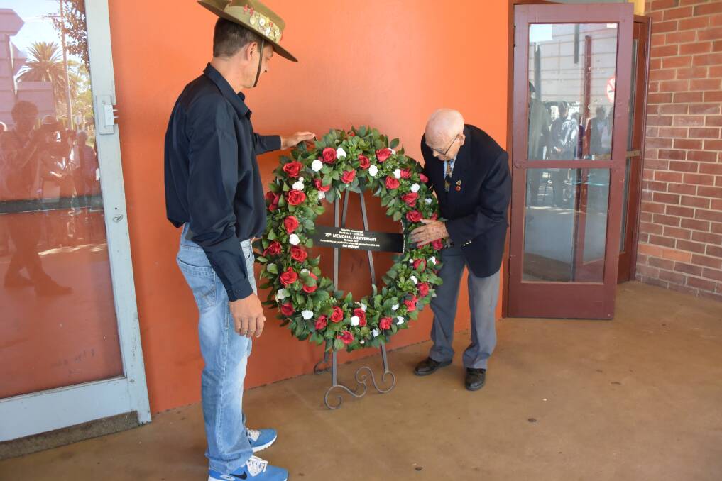 Pride of place: Former soldier Rick Wark and World War II serviceman Finley Dawe ensure the wreath is on display outside Finley's War Memorial Hall.
