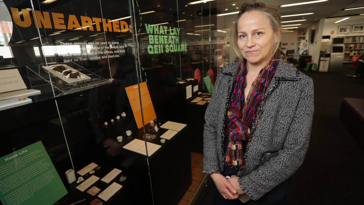 Relics on show: Sarah Myers with items being exhibited in Albury library. She spoke on Saturday of her efforts which saw 14,000 fragments found. Picture: JAMES WILTSHIRE