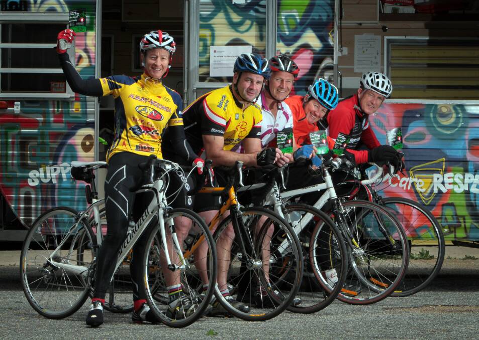 Horrifying episode: Kevin McGrath (far right) suffered "rope burns" to his arms after striking a line of wire draped across an Albury bike path. He is pictured with fellow riders Brigitte Chisholm, Peter Carter, David Beckingsale and Carolyn Higgs at an Anti Poverty Bike Ride launch in 2011.  