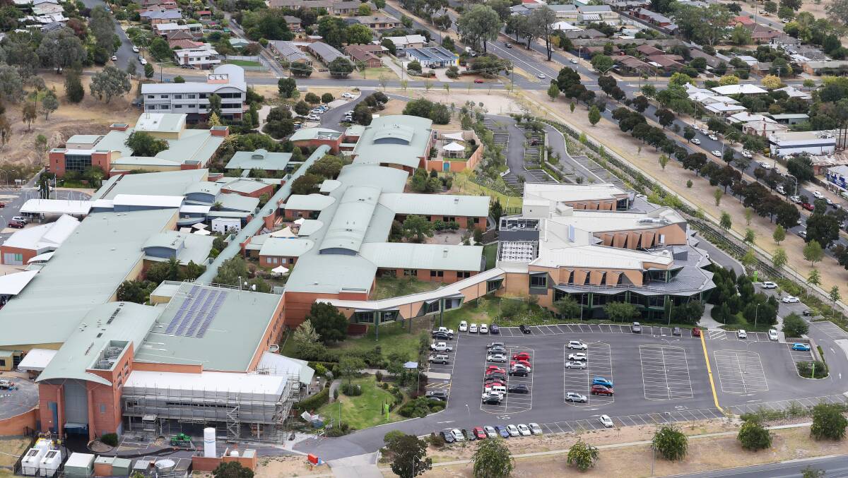 Bird's eye view: The cancer centre (right) is joined to the Albury hospital (left) by a walkway, but movement between the two has been reduced given the coronavirus pandemic, oncologist Craig Underhill said.