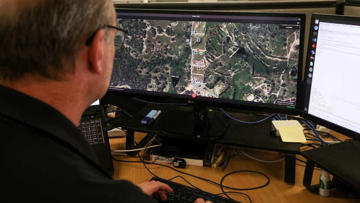 Chief software engineer Mark Wrennall at work. He develops programs for the live target systems being used across the world, including at the Kapooka army base near Wagga. Picture by James Wiltshire