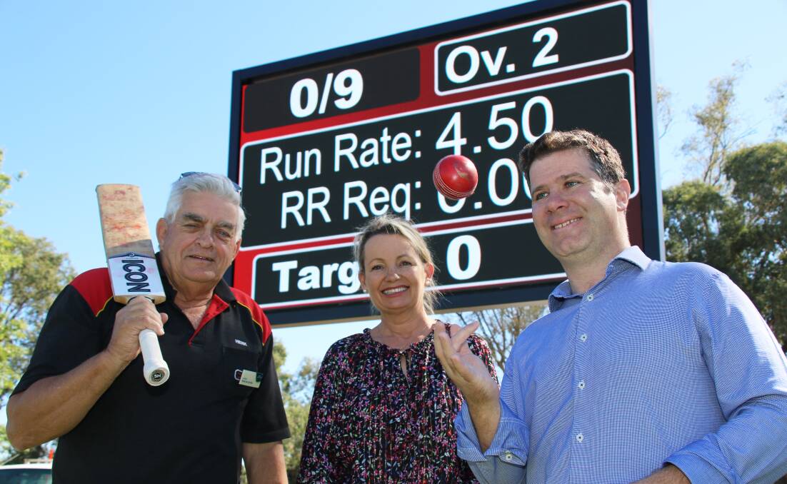 Runs on the board: Albury councillor Henk van de Ven, federal Liberal MP Sussan Ley and Liberal candidate for the NSW seat of Albury Justin Clancy in front of a new jointly-funded electronic scoreboard at Urana Road Oval.