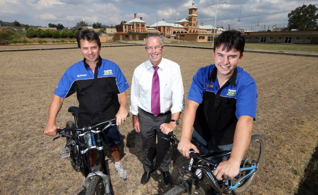 Flashback: Cycle Station partners Terry Wolki and Jacob Wolki (left and right) in 2013 with Baker Motors director Stuart Baker on the Winsor Park bowls green which has since been transformed into the site of Cycle Station.