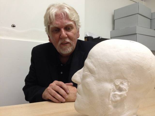 Face of history: Gary Hunn contemplates a death mask of bushranger Mad Dan Morgan at Melbourne University during filming for his documentary.