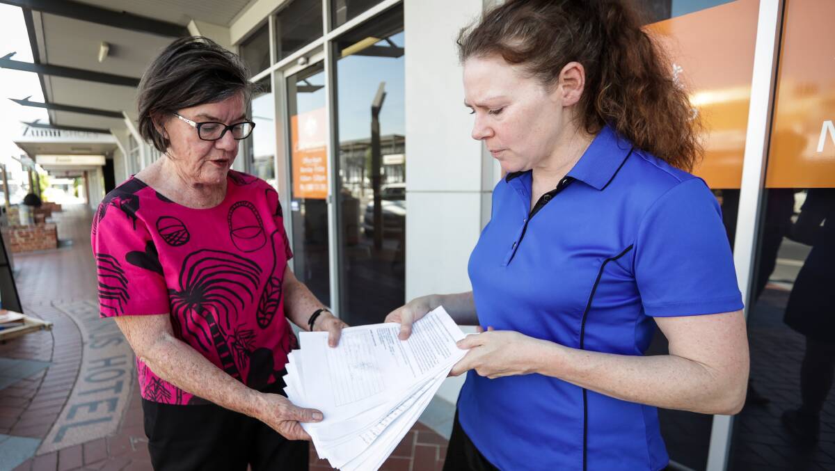 Much concern: Petitions signed by Bethanga Peninsula residents are handed to MP Cathy McGowan by Bellbridge mum Gennifer Hamam. Picture: JAMES WILTSHIRE