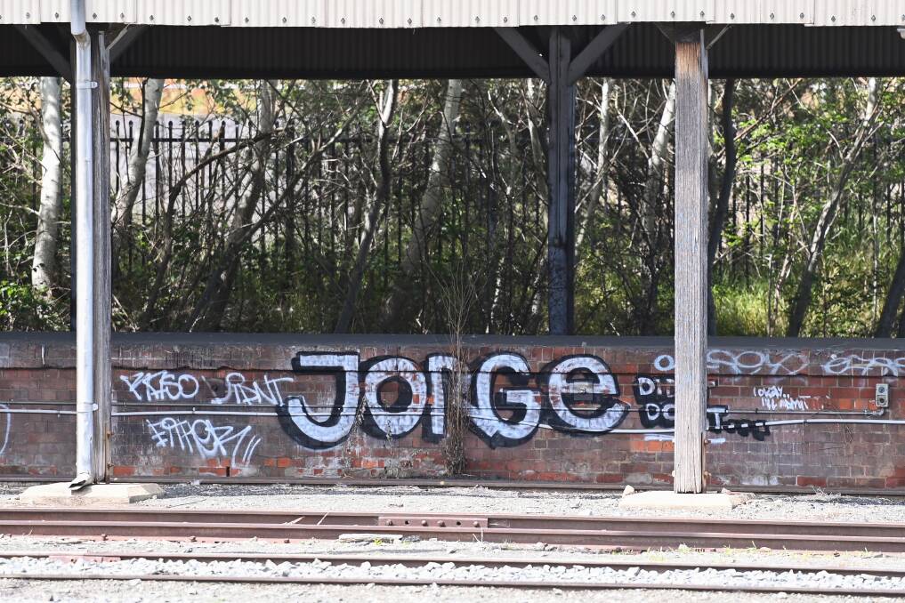 Left to linger: Graffiti on an old railway siding in the Albury station yard. The ARTC states it will continue "efforts to remove graffiti when identified in timely manner". Picture: MARK JESSER 