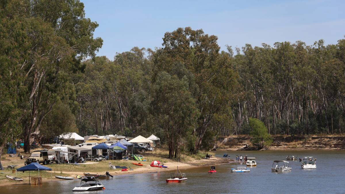 Grab you ground: Campers on the Cobram side of Quicks Beach with their caravans and pleasure watercraft.