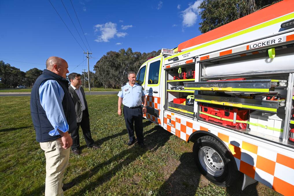 Tools galore: Emergency Services Minister David Elliott and member for Albury Justin Clancy join Albury SES deputy unit commander Darren Hawke in looking at gear inside the new storm truck used for jobs by the group. Picture: MARK JESSER