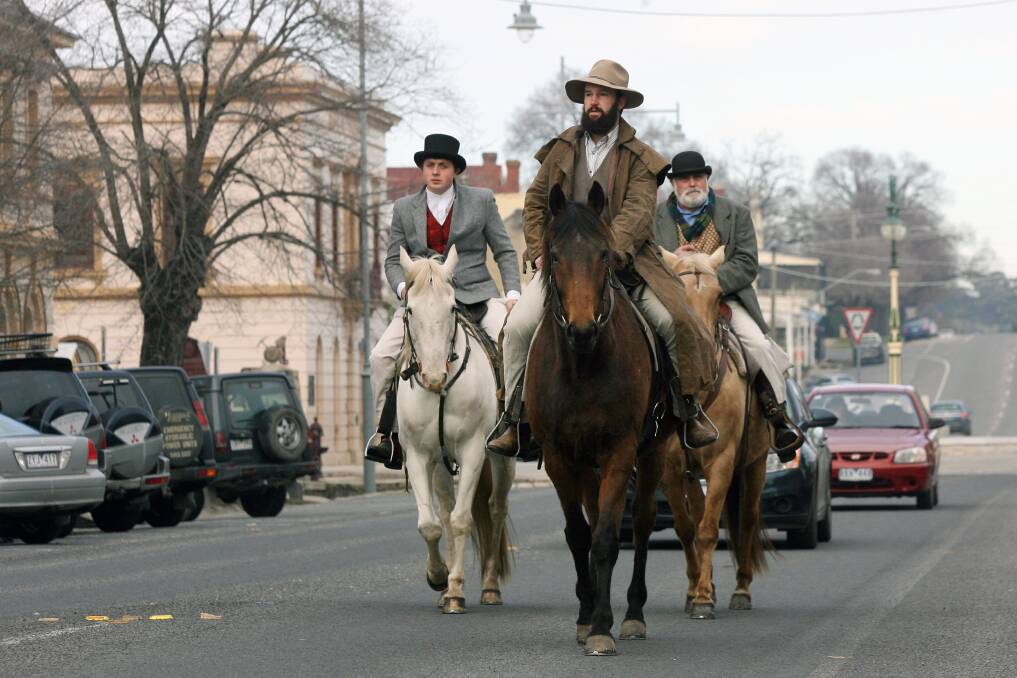 Equine connection: Rider Matt Aldridge plays bushranger Ned Kelly during a re-enactment at Beechworth in 2014. Horses will be enlisted next weekend for a heritage ride to bring attention to the fight for a Ned Kelly centre at Glenrowan.