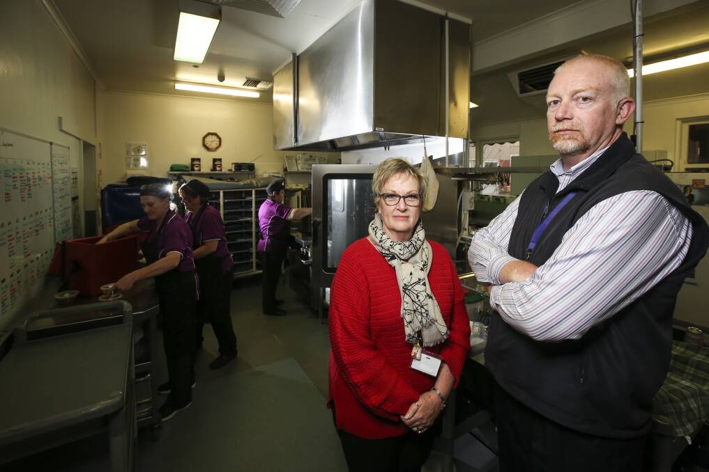 Not up to scratch: Catering manager Toni Chubb and Indigo North Health chief Shane Kirk in the cramped kitchen which has been deemed unsafe.