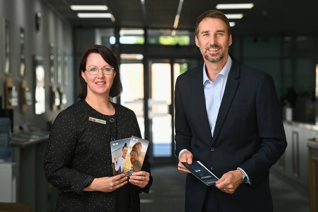 Fresh image: BankWAW chairwoman Fiona Shanks and chief executive Michael Mack with brochures and a bank slip with the new colours and logo. Picture: MARK JESSER