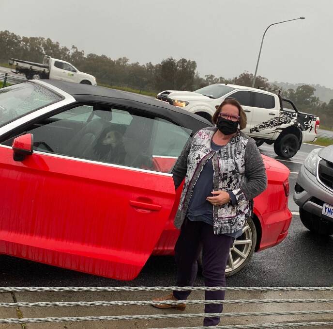 Canberran Anne Cahill Lambert and dog Hunny were stranded on the Hume Highway due to the NSW-Victoria border closure. 