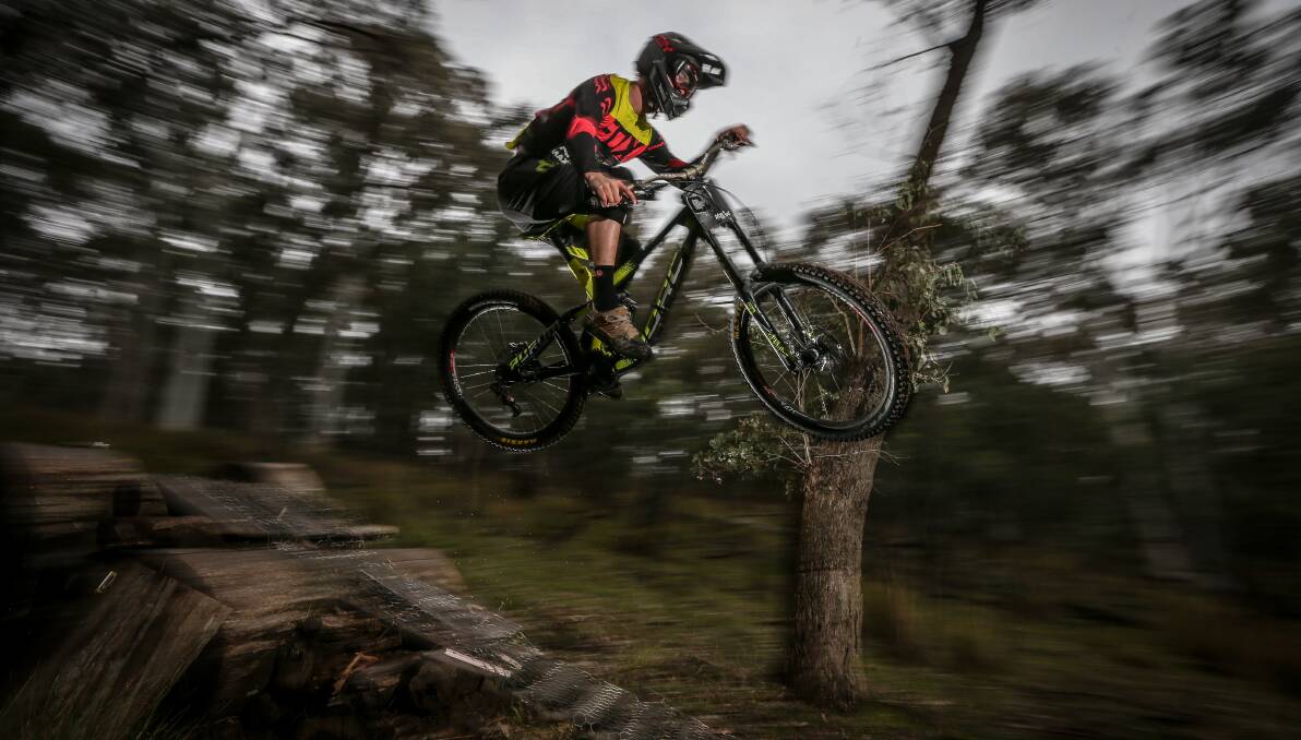 FLASH AND PAN: Two flashes and some panning to capture Yackandandah's downhill mountain bike rider Oliver Zwar sending it on a overcast afternoon. 