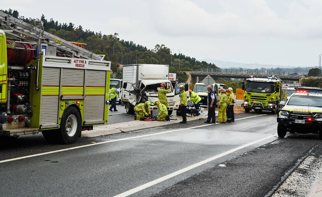 Emergency services attend a truck crash on the Federal Highway outside Canberra. Picture: Matt Loxton