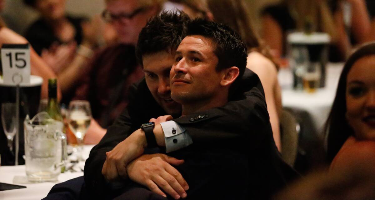 BAD LUCK, MATE: Aaron Weathers gives North Albury star Nick Holman a hug after he polled the most votes but was ineligible to win the Morris Medal. Picture: MARK JESSER