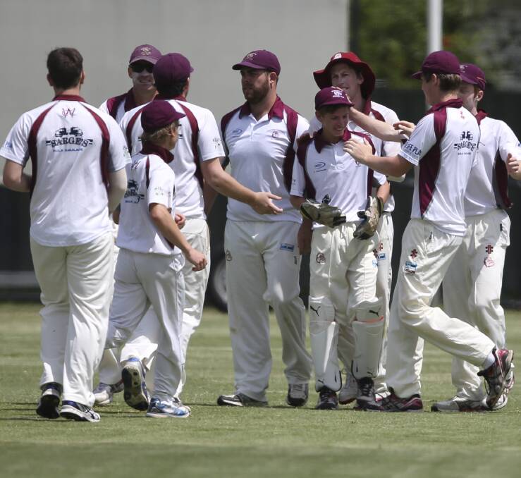 START THE CELEBRATIONS: Wodonga celebrates one of 10 East Albury wickets to fall on Saturday. Picture: ELENOR TEDENBORG