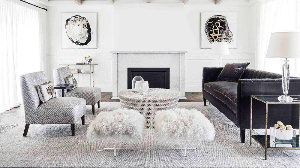 WELL COVERED: Oversized rugs that are large enough to sit underneath both the sofa and coffee table work well in a living room.