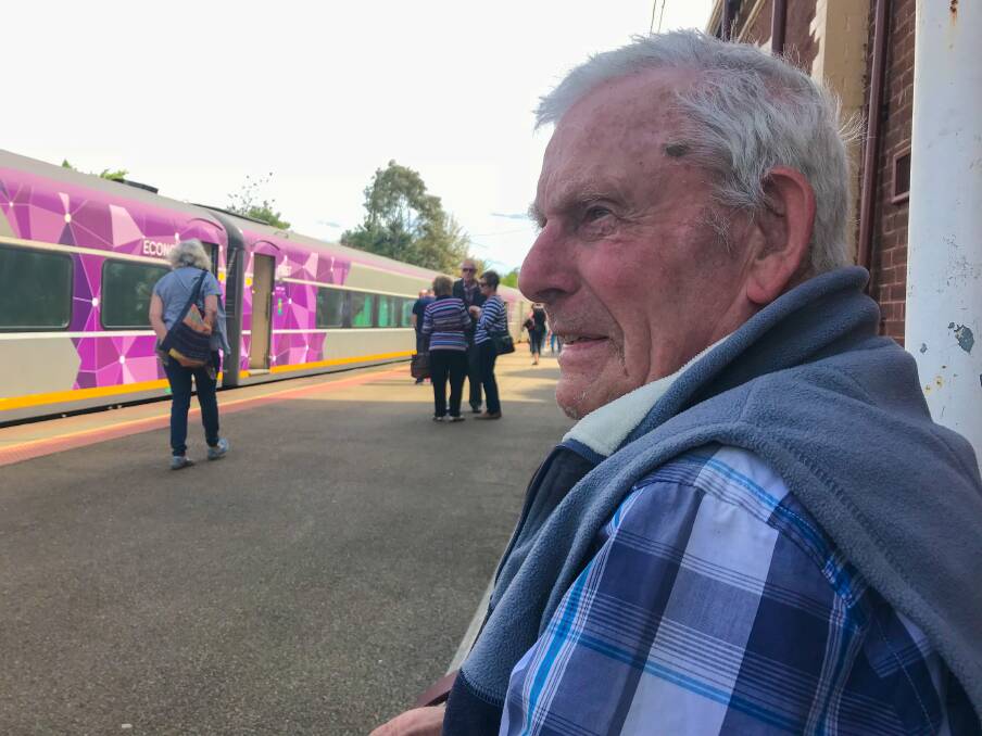 STOPPED IN HIS TRACKS: Peter Vaughan waits patiently at Seymour Station for the next V/Line announcement - hoping he won't have to catch a bus to Wangaratta.