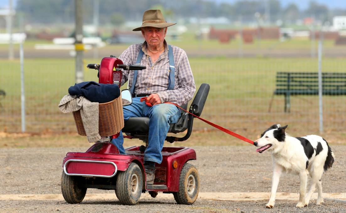 These days, 85-year-old Laurie Slater uses a scooter to travel from one end of the dog trials to the other. In Sydney at the Supreme Australian Sheep Dog Championships. Photo: GEOFF JONES