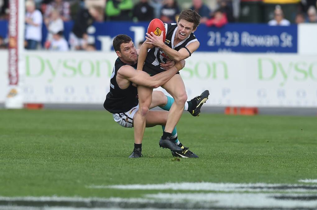 Lavington's Adam Butler tackles Wangaratta's Harry Smart in last year's grand final. Will we see a grand final re-match in what will be the most unique season in O and M's 127 years?