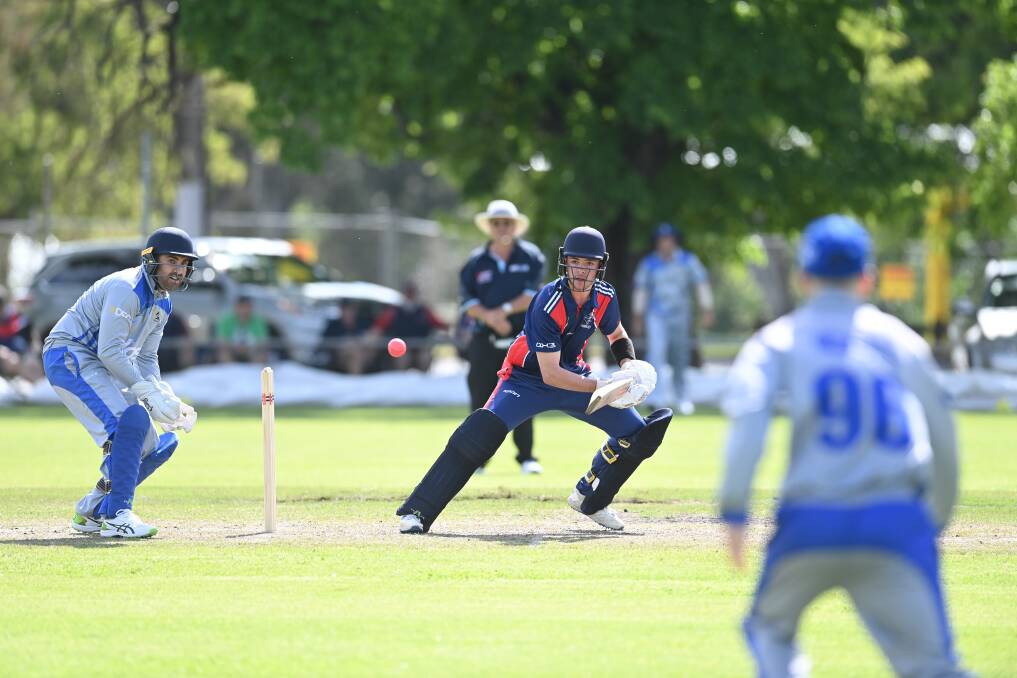 Raiders' Kane Scott pushes for a run in Albury wicketkeeper Nat Sariman's first game for Albury after moving from Belvoir. Picture: MARK JESSER