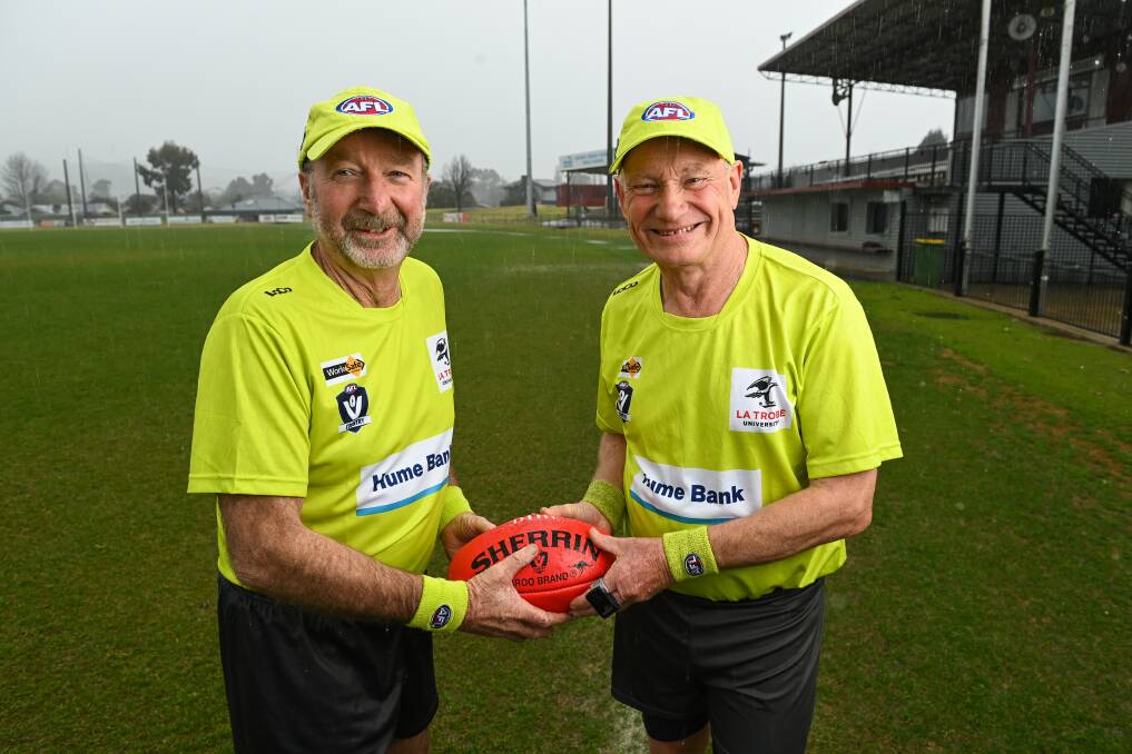 DYNAMIC DUO: Umpire Michael McGee (left) will celebrate 700 games on Saturday and will be joined by good friend Rod Sangster, who's just passed 950. Picture: MARK JESSER