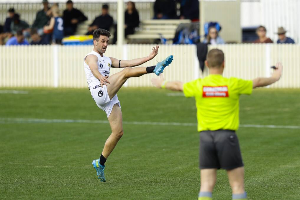MID-AIR ARTISTRY: Brad Melville kicked this goal in his return to Wangaratta colours, 12 months after he injured his knee. Picture: ASH SMITH