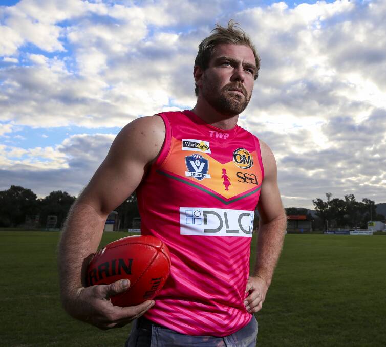 PINK DAY: North Albury's Rory Feltwell dons the jumper the Hoppers will wear as part of the annual "Pink Day" luncheon on Saturday, in aid of Bravehearts. Picture: JAMES WILTSHIRE