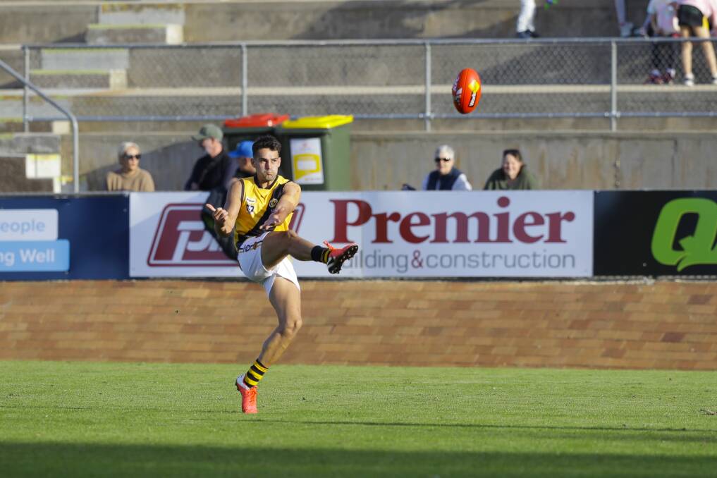 SIX NOT OUT: Albury's Mat Walker kicks one of his six goals against Lavington. It was his second game this year after nailing five in round one. Picture: ASH SMITH
