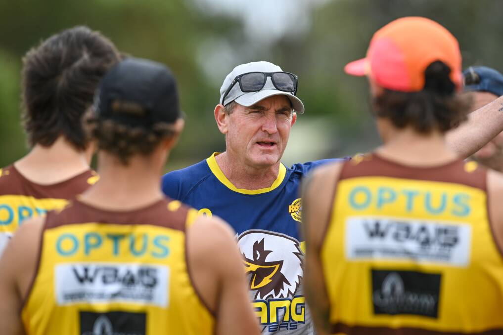 Hawks' co-coach Daryn Cresswell (centre) is looking to make sure his players adhere to the new 'stand the mark' rule.