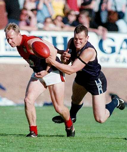 FIERCE DETERMINATION: Chris Stuhldreier (right) shows the desire he displayed through his four-year stint against Wodonga Raiders in the 1998 grand final. Raiders won by 64 points, while Albury beat Lavington in '96.