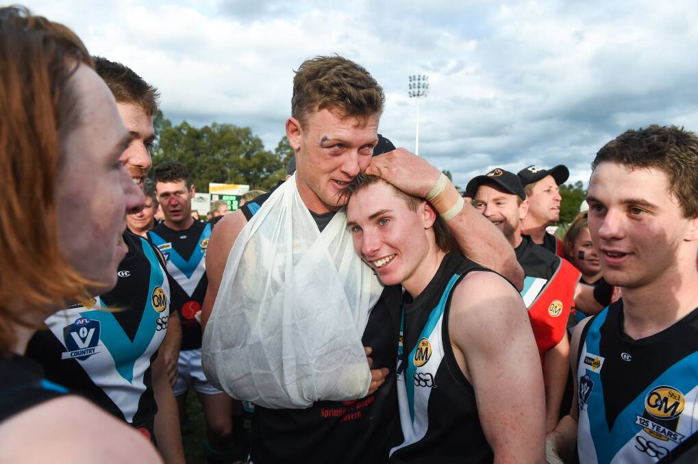 BUSTED: Lavington's Nick Meredith (left) congratulates Clayton Marsh. Meredith snapped his collarbone late in the third term. Picture: MARK JESSER