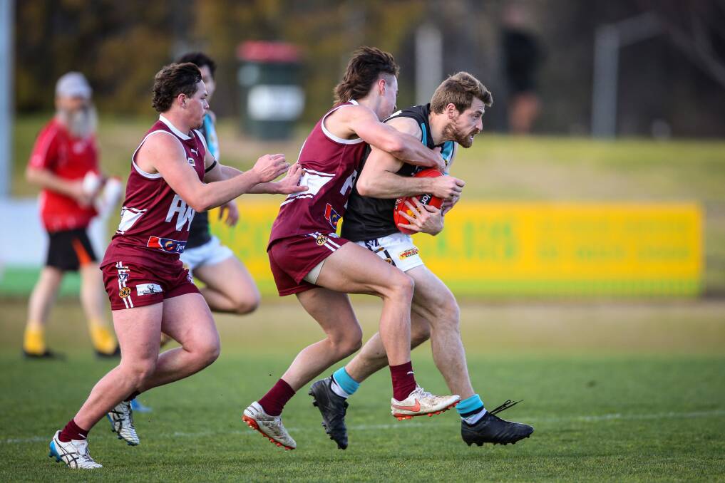 CAUGHT: Lavington's Sam Hargreave is tackled by Wodonga's Noah Bradshaw on Saturday. Picture: JAMES WILTSHIRE