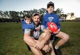 Kade Kuschert played his 300th game for the Roos in 2018, with sons Hudson, then 8, and Judd, then 12, supporting dad. Now Judd is playing alongside his father.