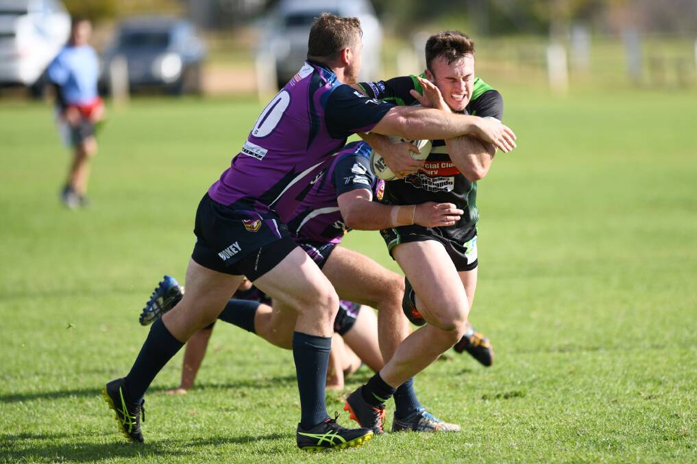 RAMPAGING RUN: Albury Thunder's Liam Wiscombe charges ahead as Southcity's Cameron Copeland tackles him. Picture: THE DAILY ADVERTISER