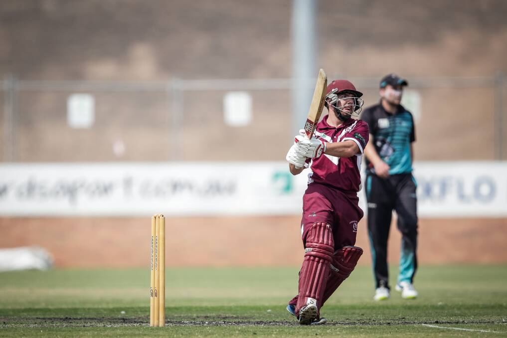 BJ Garvey hits out during his crucial innings of 45 in the preliminary final loss to Lavington. Picture: JAMES WILTSHIRE