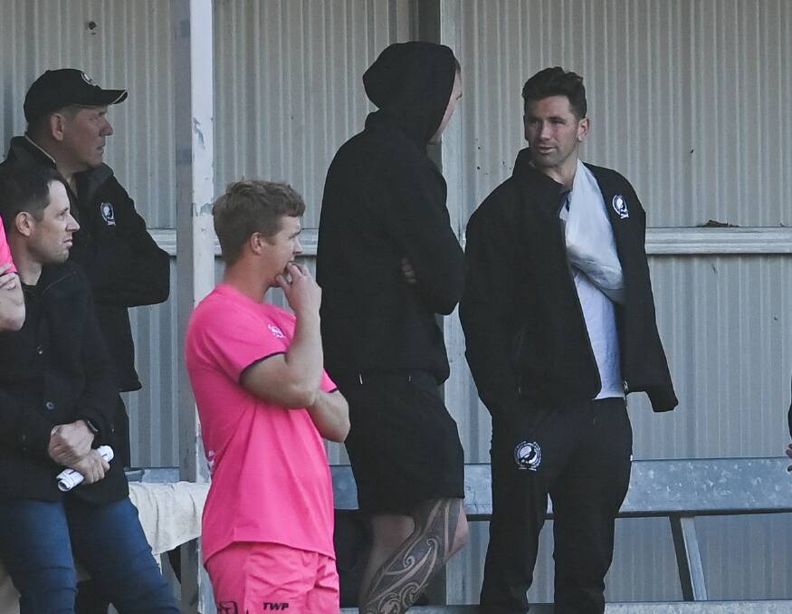 BAD NEWS: Mat Grossman (right) had his arm in a sling during the second half of the loss to Yarrawonga and underwent surgery on Sunday. Picture: MARK JESSER