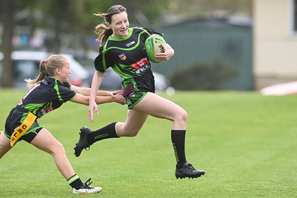 FULL FLIGHT: Hope Souhrada is caught in mid-air in Albury Thunder Junior Rugby League Club's final round. Pictures: MARK JESSER