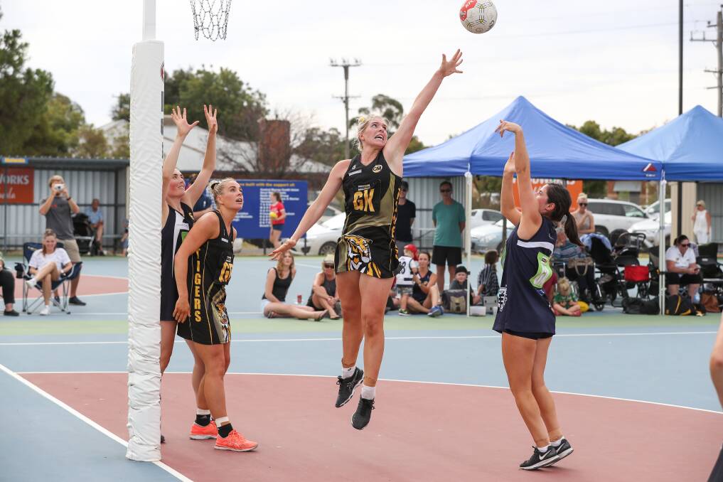 TALL TIMBER: Albury's Bridget Aughton strives to stop Yarrawonga scoring in their clash. Aughton joined her sister Olivia in defence. Picture: MARK JESSER