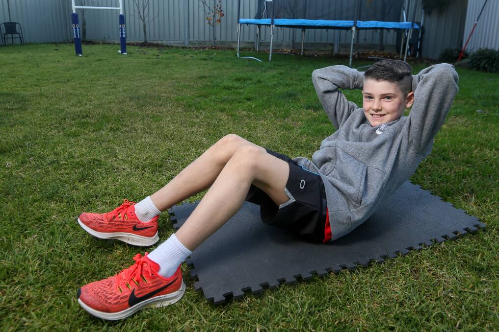 WELL DONE, ZACK: Thurgoona's Zack Emmett is waiting to hear if his feat of 2300 sit ups is a world record for a child under 10. Picture: TARA TREWHELLA