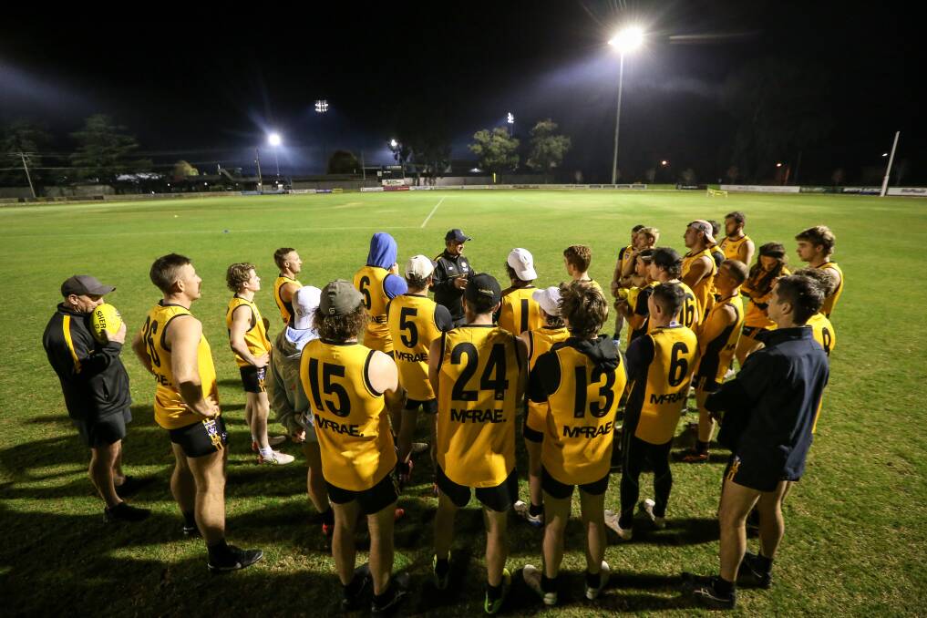 O and M coach Damian Sexton addresses his players on Wednesday night.
