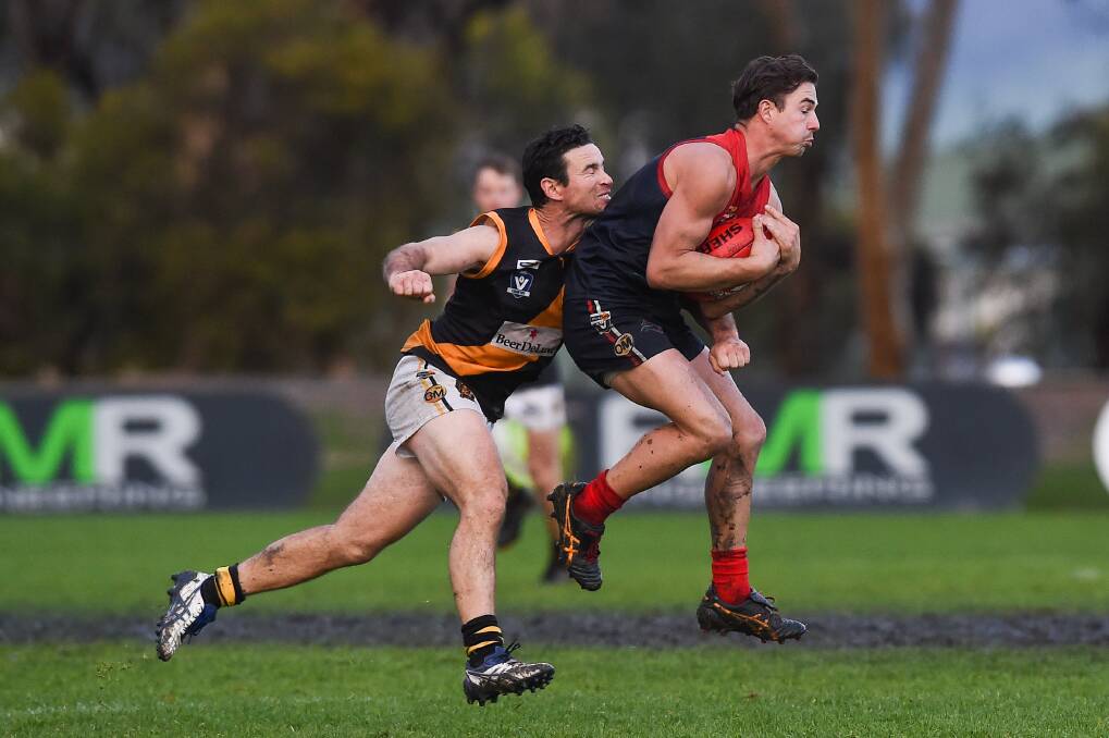 Albury's Luke Packer tries to spoil Wodonga Raiders' Raven Jolliffe in their clash last month. Packer has been ruled out for the away game against the Roos.