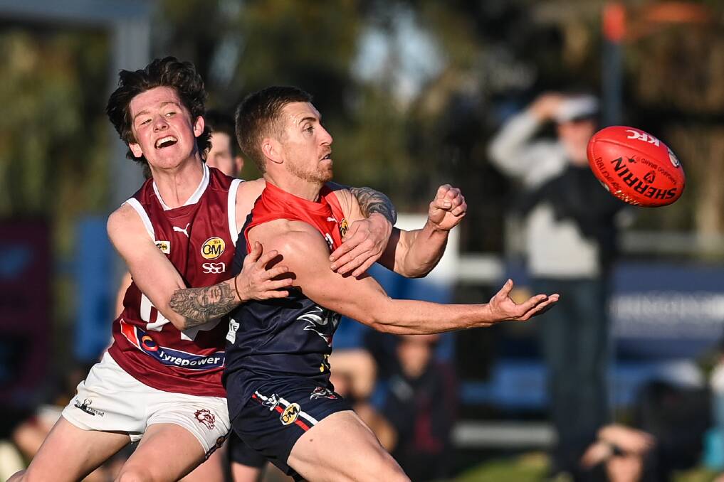 Wodonga's Ethan Redcliffe tackles Wodonga Raiders' Shane Munro in the thrilling clash on Saturday. Raiders kicked a goal with 85 seconds left.