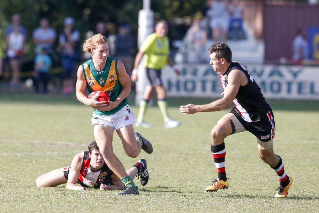 HE'S AWAY: North Albury's Tom Gallaway looks to push away from the defence in the Hoppers' 11-point loss to Myrtleford.